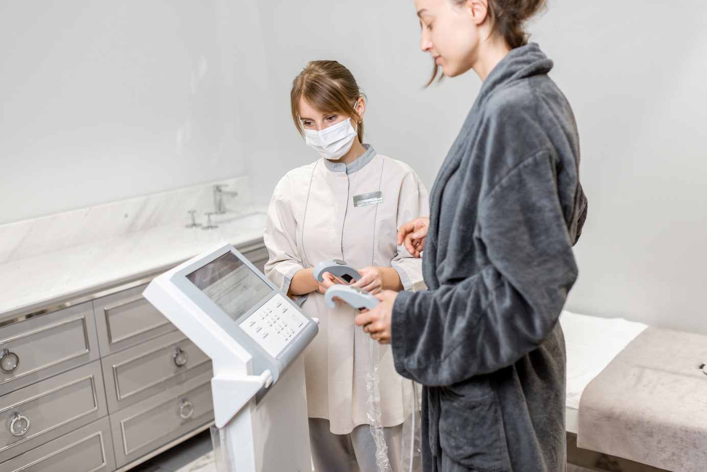 Woman with a medic during Inbody test at Spa